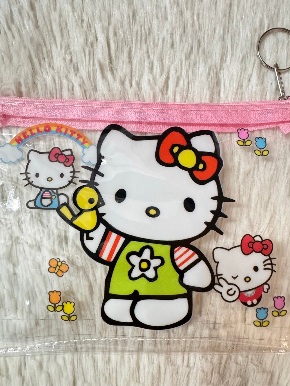Hello Kitty clear pouch with pink zipper and Hello Kitty graphic